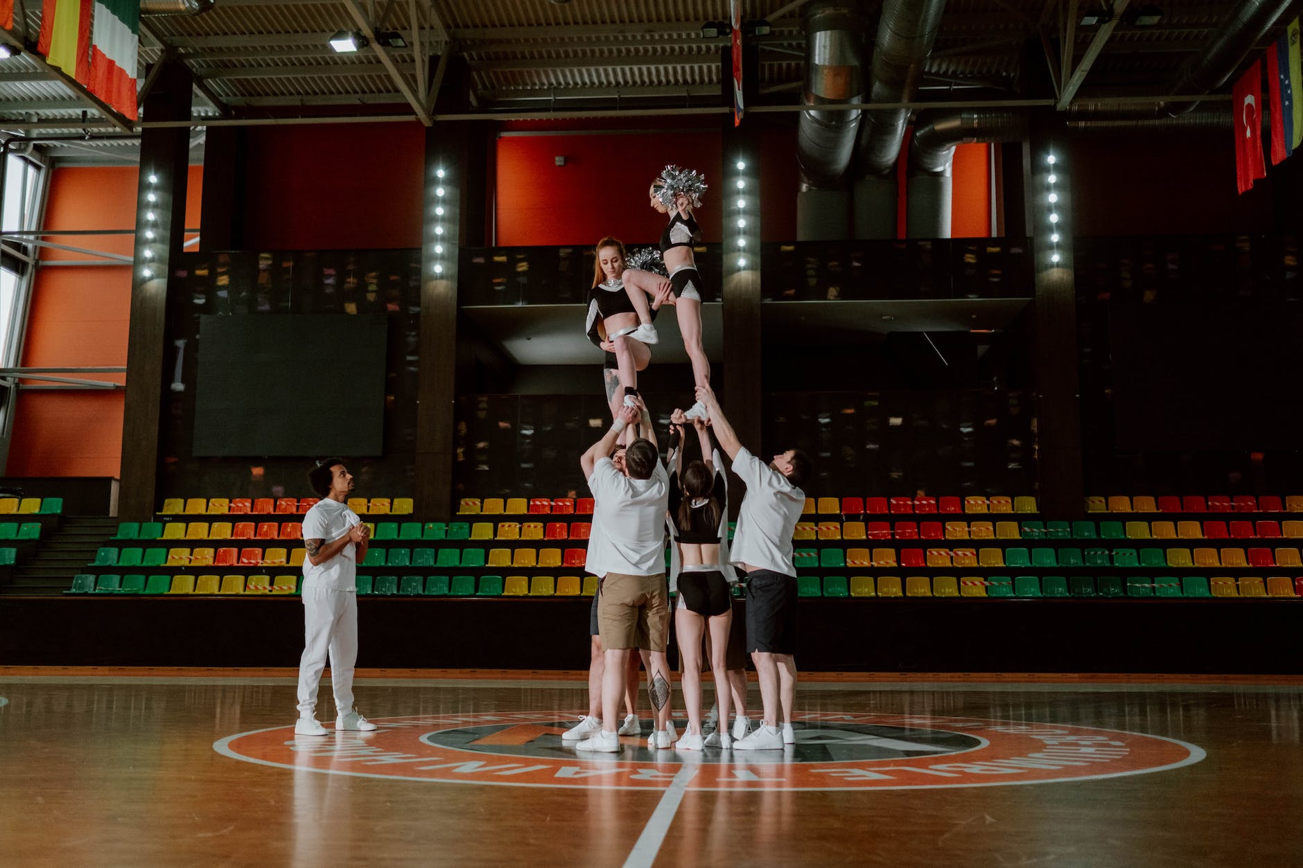 cheerleading squad practicing inside the gymnasium