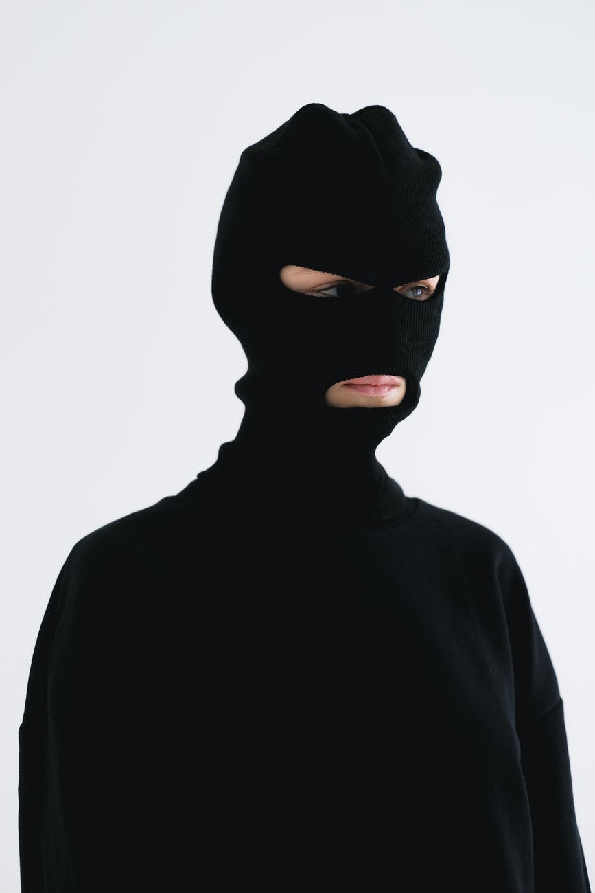 close up shot of a person wearing a robber mask